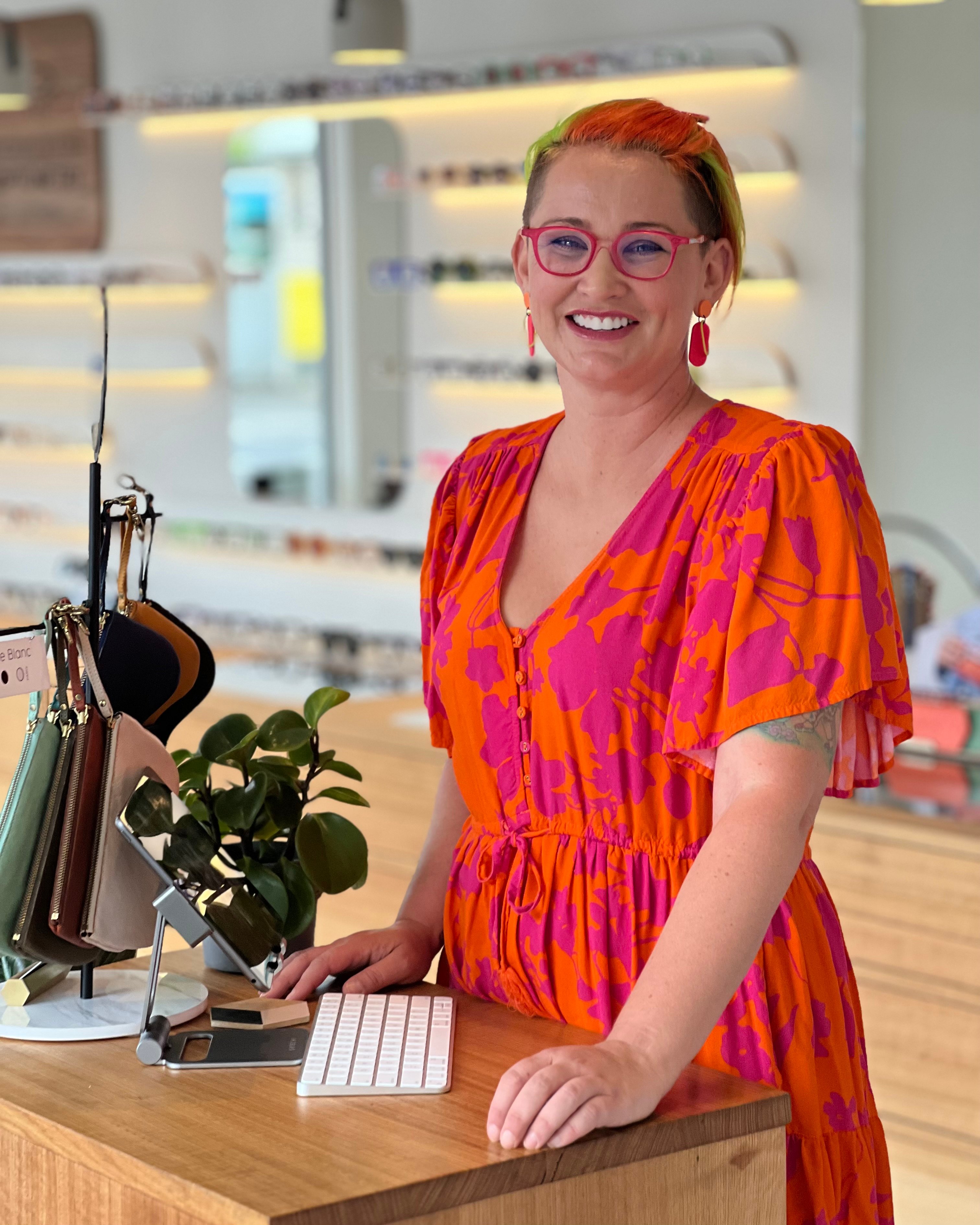 Optical Assistant in bright and colourful dress and glasses